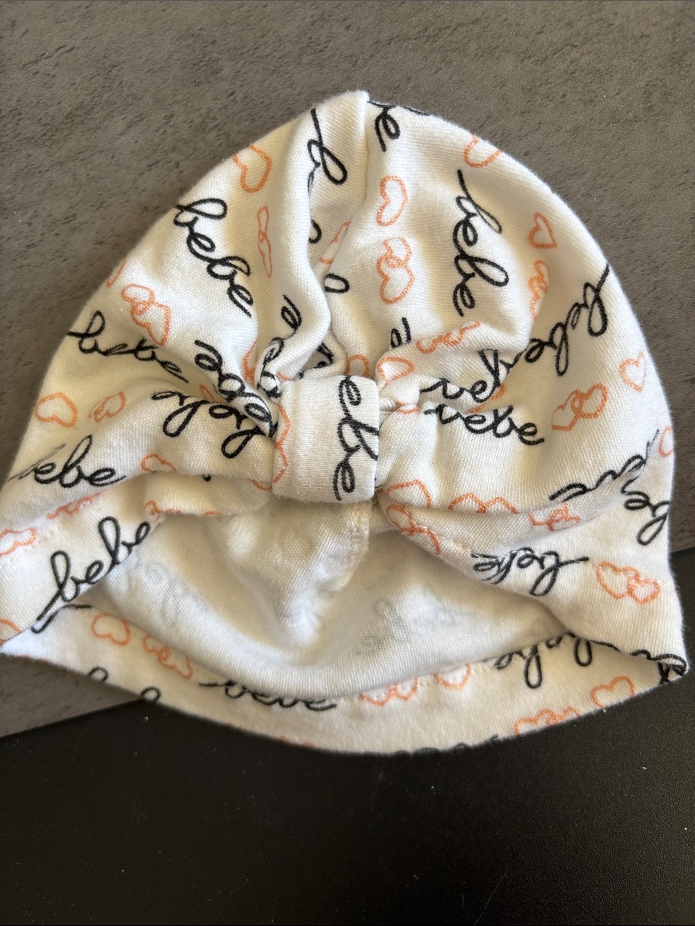 bebe White Knit Bow Beanie Turban with Peach Hearts and Black Script